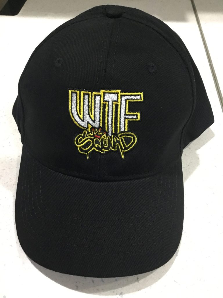 Black cap with yellow embroidered logo.